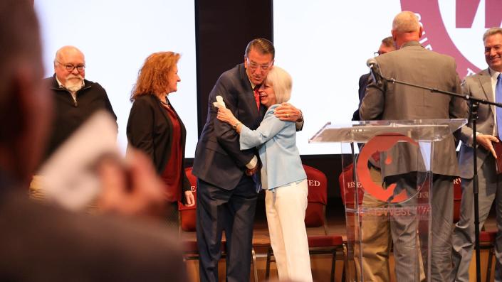 WT President Walter V. Wendler hugs Terry Rogers following the announcement of the new name of the Terry B. Rogers College of Education and Social Sciences.