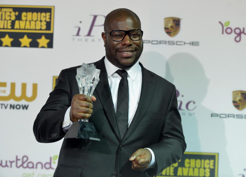 Steve McQueen poses in the press room with the award for best picture for "12 Years a Slave" at the 19th annual Critics' Choice Movie Awards at the Barker Hangar on Thursday, Jan. 16, 2014, in Santa Monica, Calif. (Photo by John Shearer/Invision/AP)