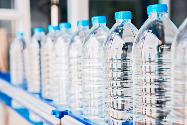 <p>cofotoisme/Getty</p> Plastic bottles of water.