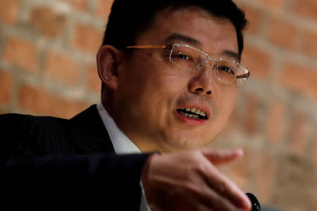 FILE PHOTO: Wang Zhenmin, the head of the law department of China's representative office in Hong Kong, speaks during a luncheon in Hong Kong, China April 12, 2016. REUTERS/Bobby Yip/File Photo