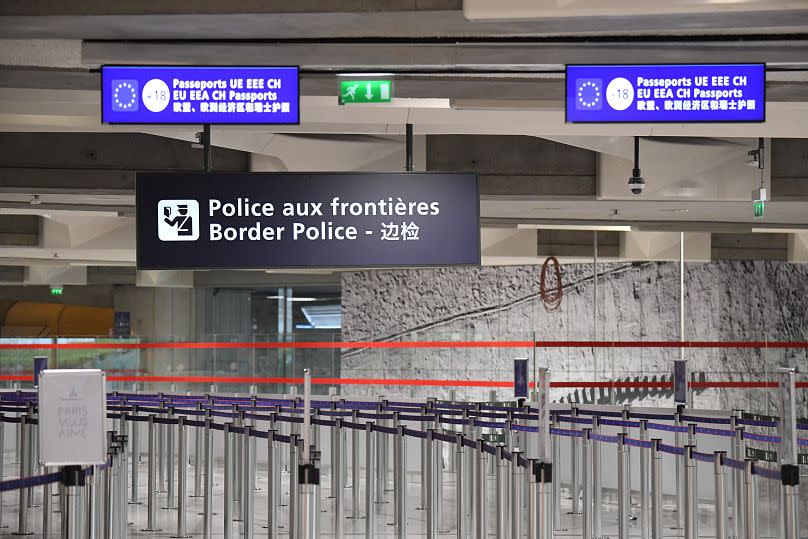 Empty waiting lines at the border police control points at Roissy-Charles de Gaulle Airport, north of Paris.