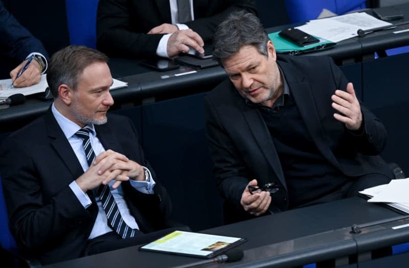 German Minister of Finance Christian Lindner, and Vice-Chancellor and Minister for Economic Affairs and Climate Protection Robert Habeck attend a plenary session to discuss the second Budget Financing Act 2024 at the German Bundestag. Britta Pedersen/dpa