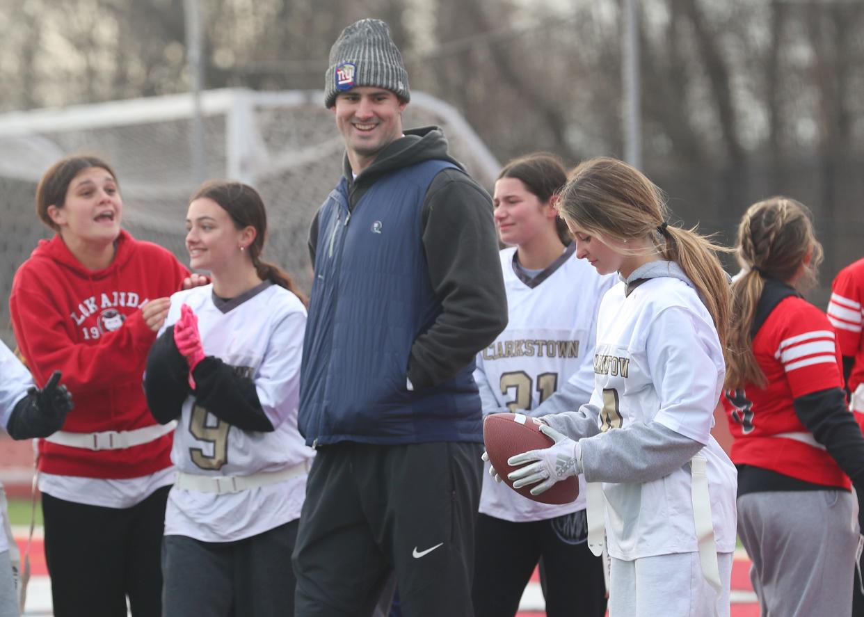 Giants quarterback Daniel Jones talks to flag football athletes as the New York Giants and Section 1 hosted the third annual Section 1 Girls Flag Football Jamboree at Somers High School March 19. 2024.