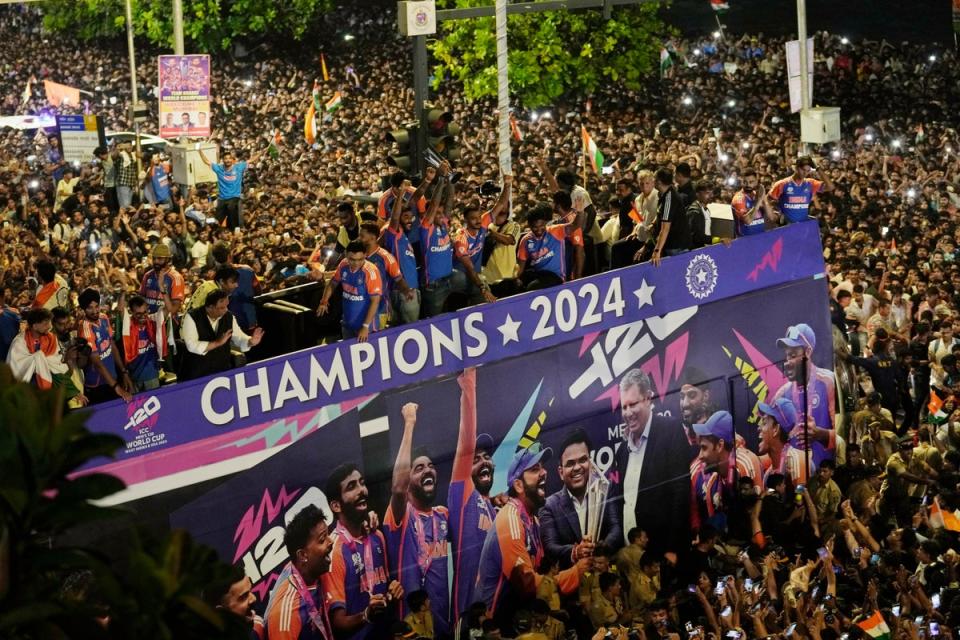 Fans surround a bus carrying India’s cricket team during a parade celebrating their T20 Cricket World Cup victory (AP)