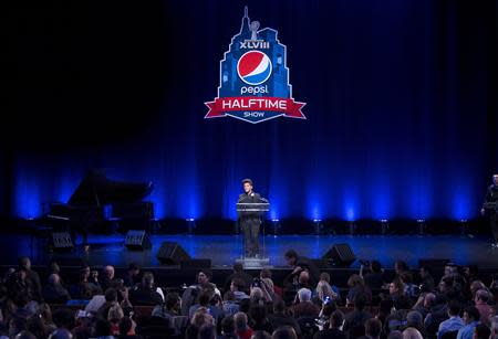 Singer Bruno Mars speaks at the Super Bowl half time press conference in New York January 30, 2014. REUTERS/Carlo Allegri