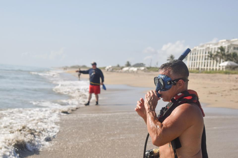 Special Ops Capt. Chuck Gordils adjusts his snorkel during a simulated drowning to practice rescue and recovery responses in Jensen Beach August 15, 2023.