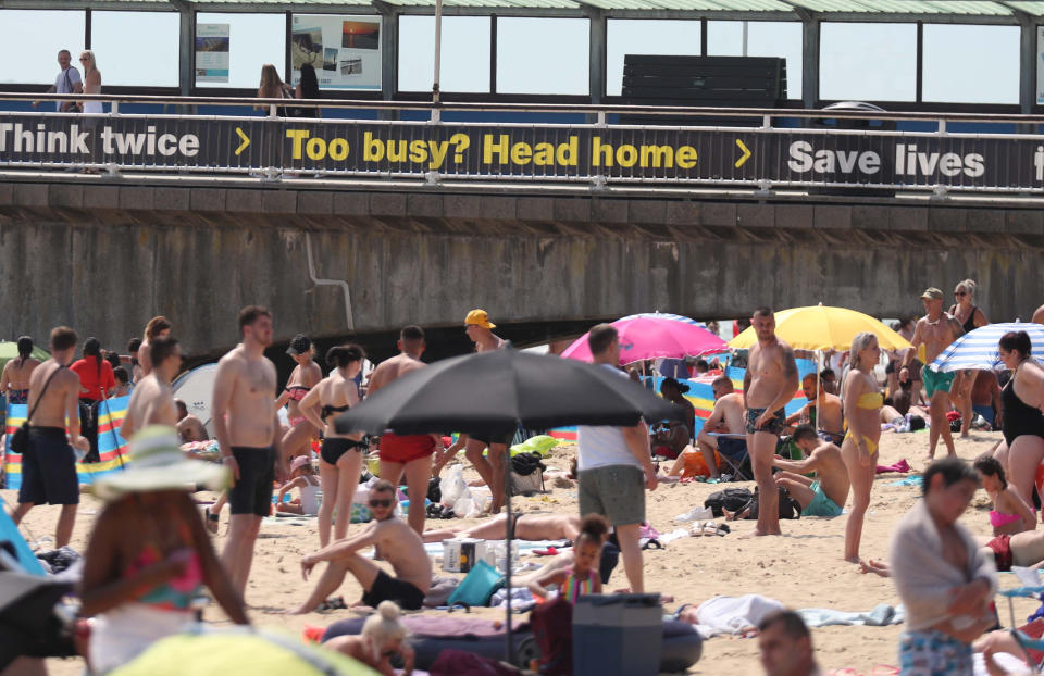 People on Bournemouth beach as the Met Office says it expects Friday to be the hottest day of the year so far with temperatures even nudging into 35C (95F) in Greater London.