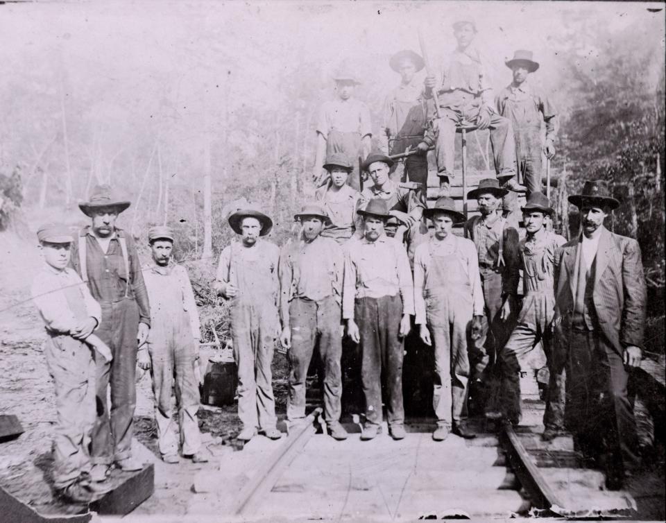 A Little River Lumber Company work crew poses on a railroad track in the Great Smoky Mountains.
