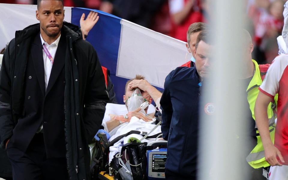 Christian Eriksen of Denmark is stretchered off the pitch after receiving medical assistance - Shutterstock