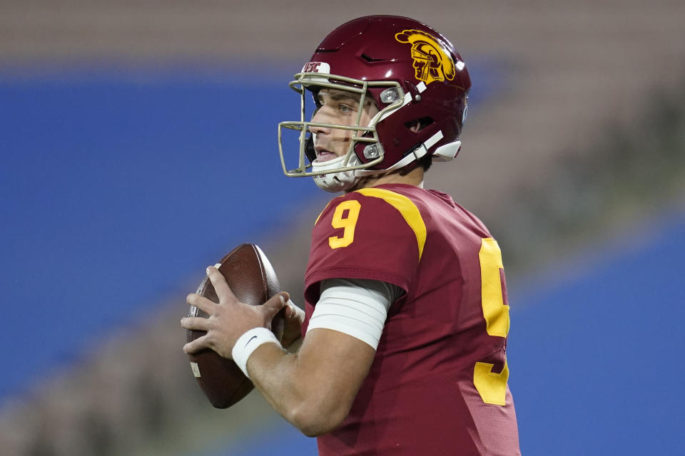 Southern California quarterback Kedon Slovis (9) looks for a receiver during the first quarter of an NCAA college football game against UCLA, Saturday, Dec 12, 2020, in Pasadena, Calif. (AP Photo/Ashley Landis)