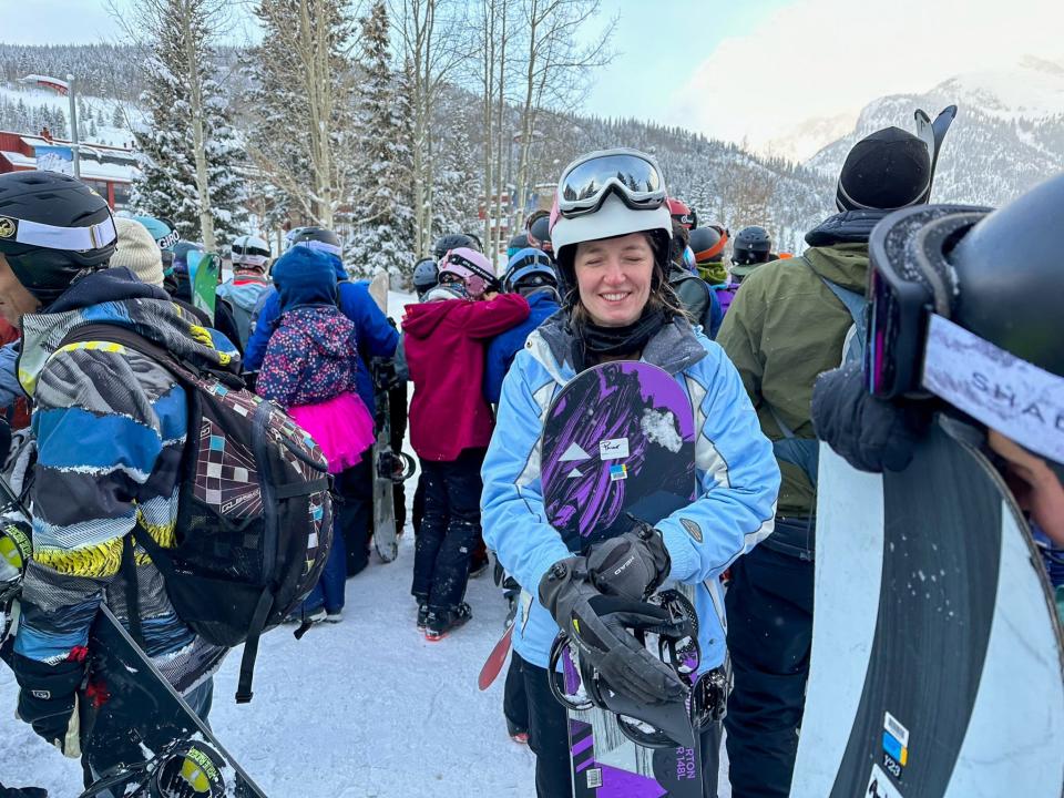 The author laughs off a long line for shuttle buses after a day of skiing at on Colorado's Copper Mountain.