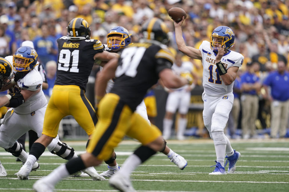 South Dakota State quarterback Mark Gronowski (11) throws a pass during the first half of an NCAA college football game against Iowa, Saturday, Sept. 3, 2022, in Iowa City, Iowa. Nearly 20 months after tearing the ACL in his left knee on a 3-yard run, and then missing the rest of that game and all of the normal 2021 fall season that quickly followed, Gronowski gets another title shot Sunday when the Jackrabbits play Missouri Valley Football Conference rival and perennial FCS champion North Dakota State. (AP Photo/Charlie Neibergall, Fiel)