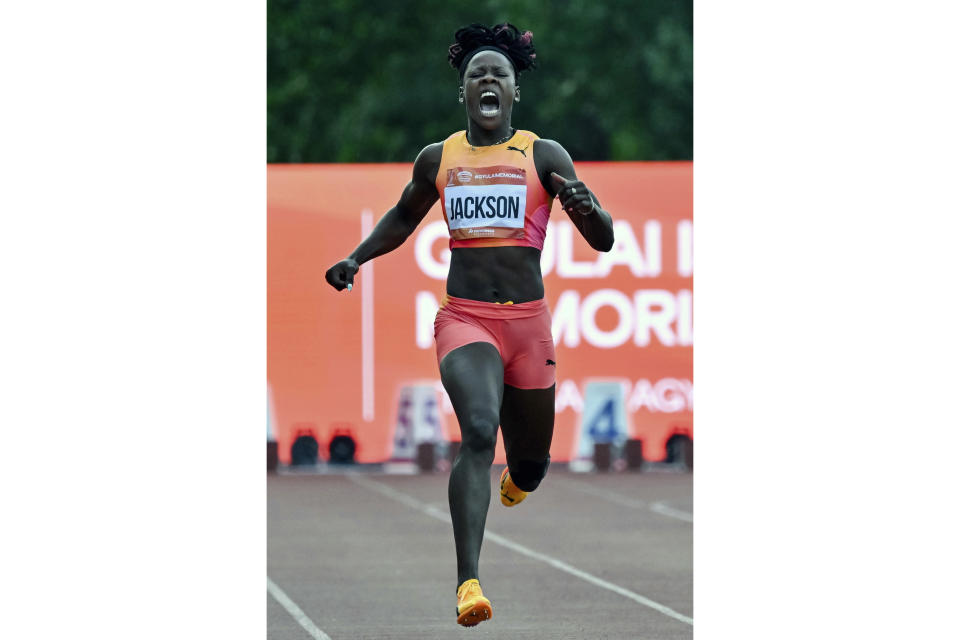 Shericka Jackson, of Jamaica, reacts to an injury during the women's 200 meter event at the Gyulai Istvan Memorial Track and Field Hungarian Grand Prix in Szekesfehervar, Hungary, Tuesday, July 9, 2024. (Tamas Vasvari/MTI via AP)