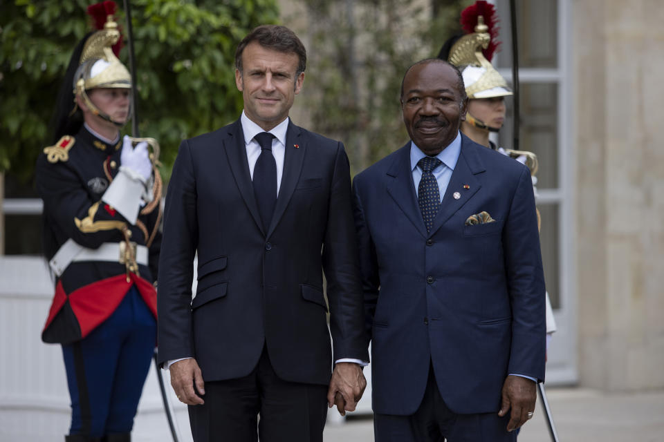 FILE - French President Emmanuel Macron, left, welcomes President of Gabon Ali Bongo at the Elysee Palace, June 22, 2023 in Paris. When Gabon's longtime leader was detained in the latest coup in Africa last week, France condemned the takeover but did little to intervene — despite having hundreds of troops in the country. It was a striking break from the past. (AP Photo/Rafael Yaghobzadeh, File)