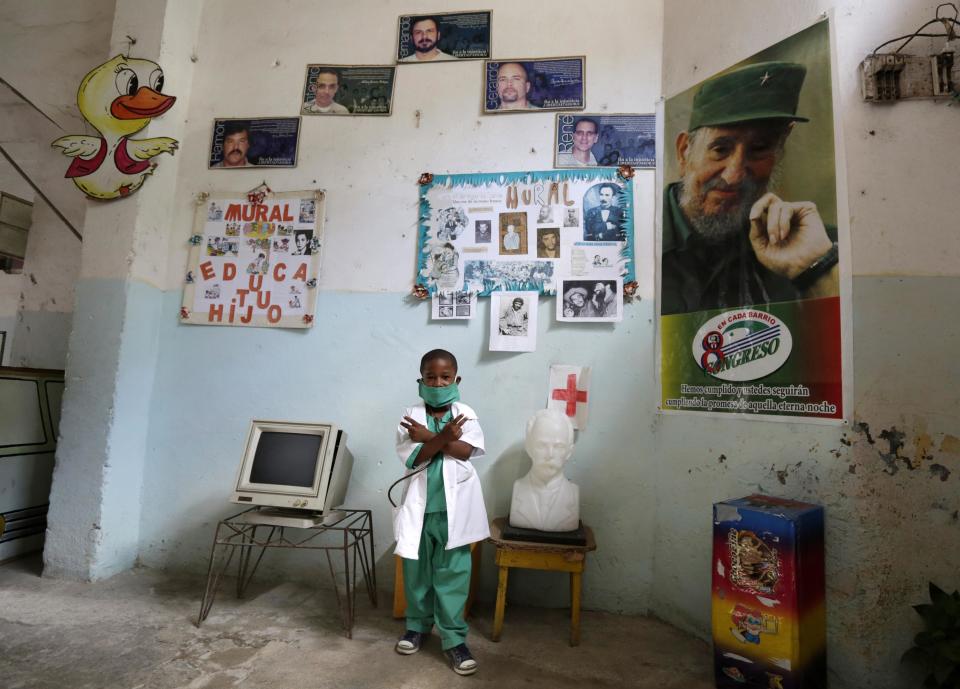 Kindergarten student at the Enrique Villuendas Primary School, Osniel Liranza, poses in his doctor costume in Havana
