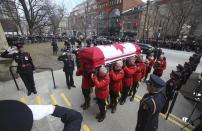 The casket of Canada's former finance minister Jim Flaherty arrives at St. James Cathedral for his state funeral in Toronto, April 16, 2014.