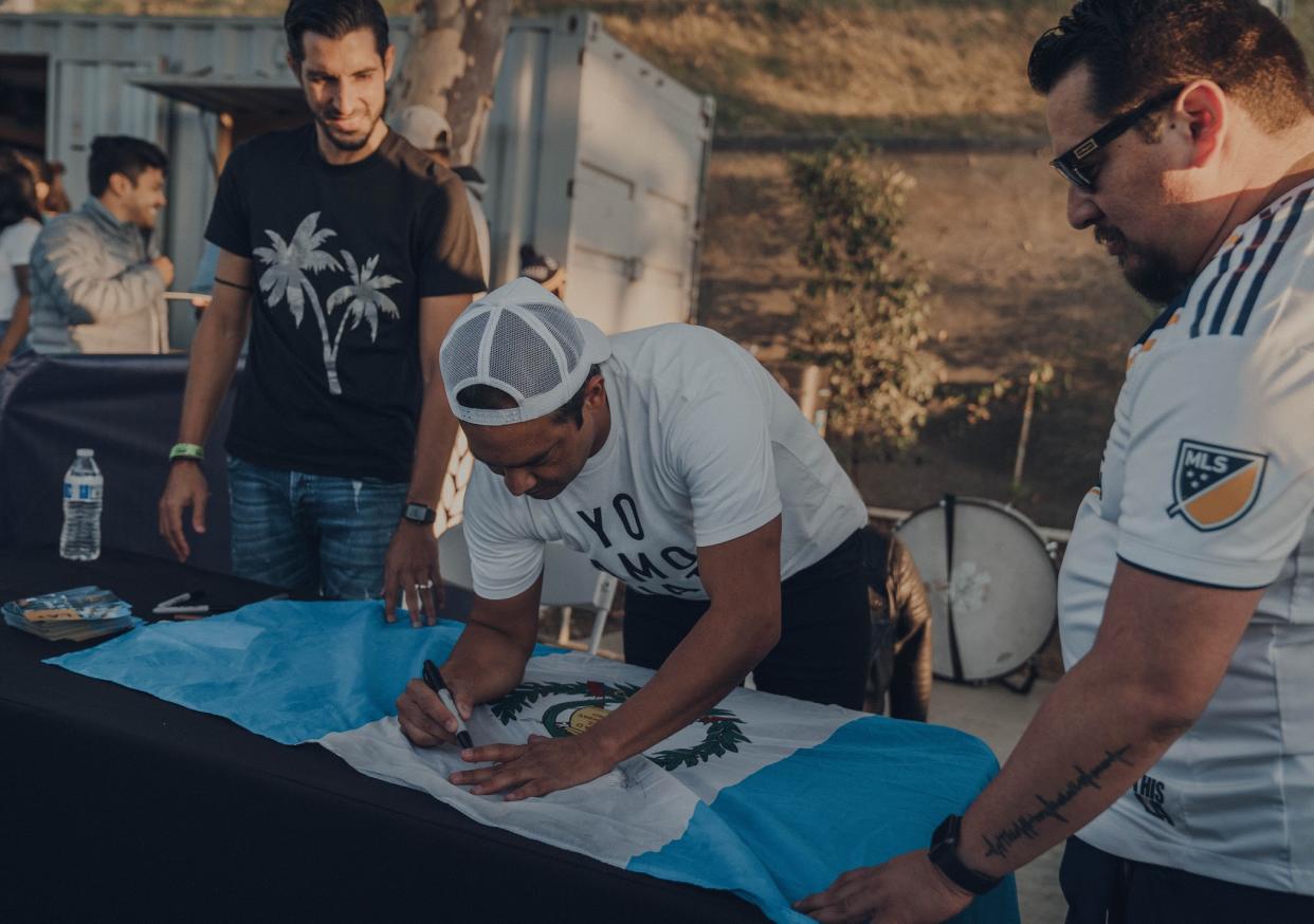Fans get their merchandise signed at a recent LA Galaxy event. (Courtesy of Darwin Rosales/Darwin Visuals)