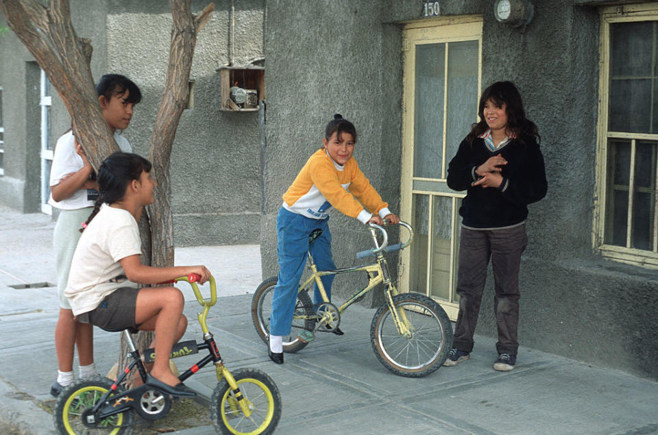 Kids hanging out outside on their bikes