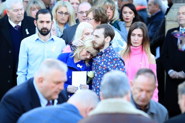 Carl Sargeant's wife Bernie and their son Jack, both centre, leave St Mark's Church in Connah's Quay, Flintshire, following the former Welsh Government Minister's funeral service (Peter Byrne/PA)