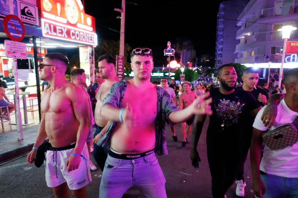 Tourists visit the popular Punta Ballena strip in Magaluf where the new law is now in force: Getty Images