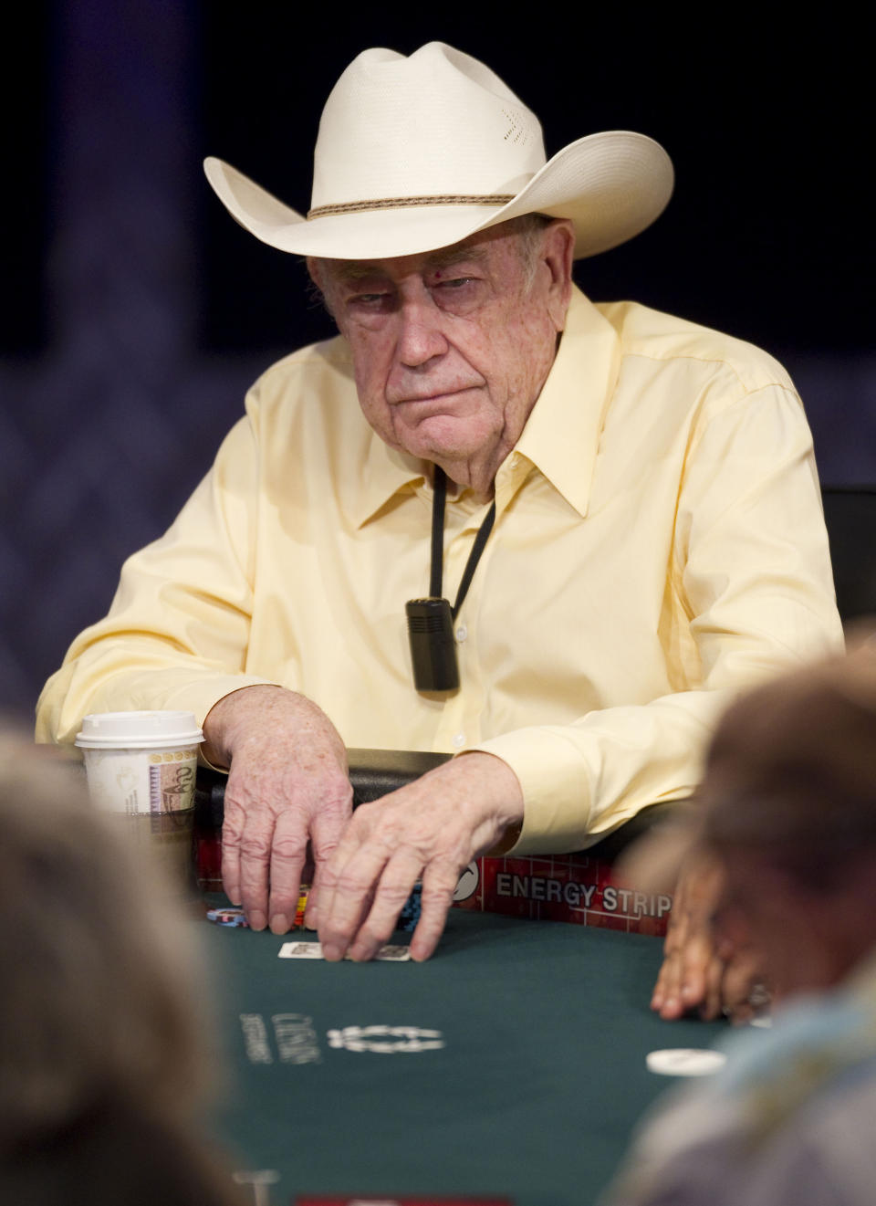 FILE - Doyle Brunson competes on the first day of the World Series of Poker, on July 7, 2011, at the Rio All-Suite Hotel & Casino in Las Vegas. Brunson, one of the most influential poker players of all time and a two-time world champion, died Sunday, May 14, 2023, according to his agent. He was 89. (AP Photo/Eric Jamison, File)