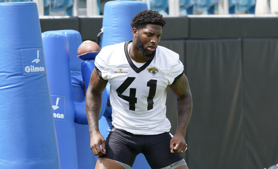 Jacksonville Jaguars Josh Allen (41) performs a drill at an NFL football practice, Monday, May 23, 2022, in Jacksonville, Fla. (AP Photo/John Raoux)