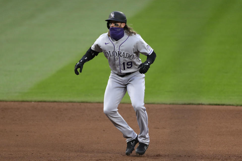 Colorado Rockies' Charlie Blackmon leads off from second base during the fifth inning of the team's baseball game against the Seattle Mariners on Saturday, Aug. 8, 2020, in Seattle. (AP Photo/Elaine Thompson)