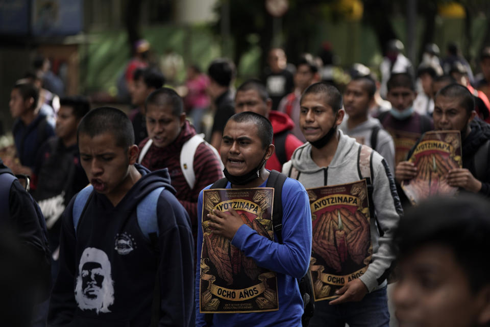 Relatives and classmates of the missing 43 Ayotzinapa college students march in Mexico City, Monday, Sept. 26, 2022, on the day of the anniversary of the disappearance of the students in Iguala, Guerrero state. Three members of the military and a former federal attorney general were recently arrested in the case, and few now believe the government's initial claim that a local drug gang and allied local officials were wholly to blame for seizing and killing the students on July 26, 2014, most of which have never been found. (AP Photo/Eduardo Verdugo)