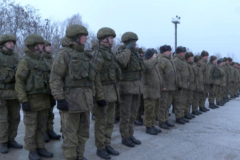 Servicemen of Russia's Eastern Military District units line up for a welcoming ceremony as they arrive at unfamiliar training ranges in Belarus.