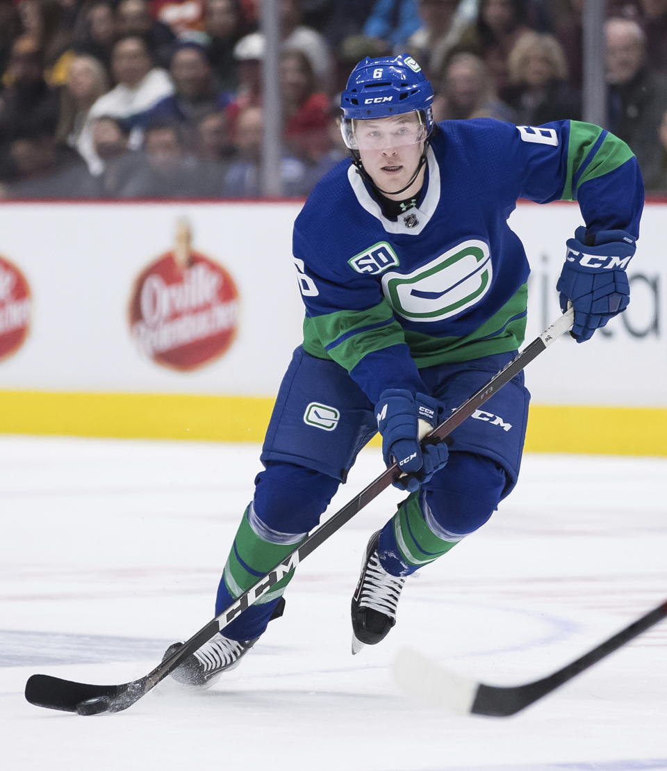 Vancouver Canucks' Brock Boeser passes the puck during the third period of an NHL hockey game against the Calgary Flames on Saturday, Feb. 8, 2020, in Vancouver, British Columbia. (Darryl Dyck/The Canadian Press via AP)