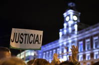 <p>A woman holds a placard reading “Justice” during a demonstration to mark the International Day for the Elimination of Violence Against Women on Nov. 25, 2017, at the Puerta del Sol square in Madrid. (Photo: Gabriel Bouys/AFP/Getty Images) </p>