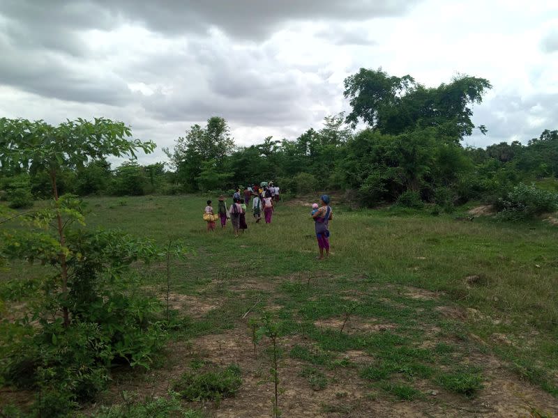 Displaced people flee violence at the town of Depayin in Myanmar's Sagaing region