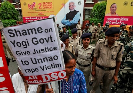Protest demanding investigation in highway collision in which woman fighting rape case against BJP legislator was injured, in New Delhi