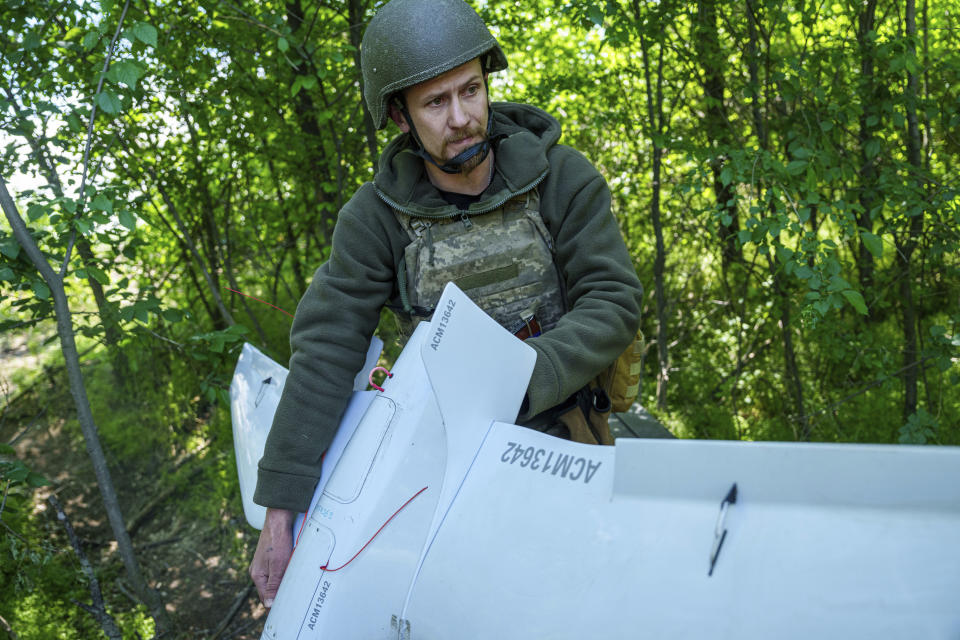 A Ukrainian serviceman Dmytro of 148th separate artillery brigade of the Air Assault Forces prepares to launch a Furia drone at the frontline in Donetsk region, Ukraine, Thursday May 9, 2024. (AP Photo/Evgeniy Maloletka)