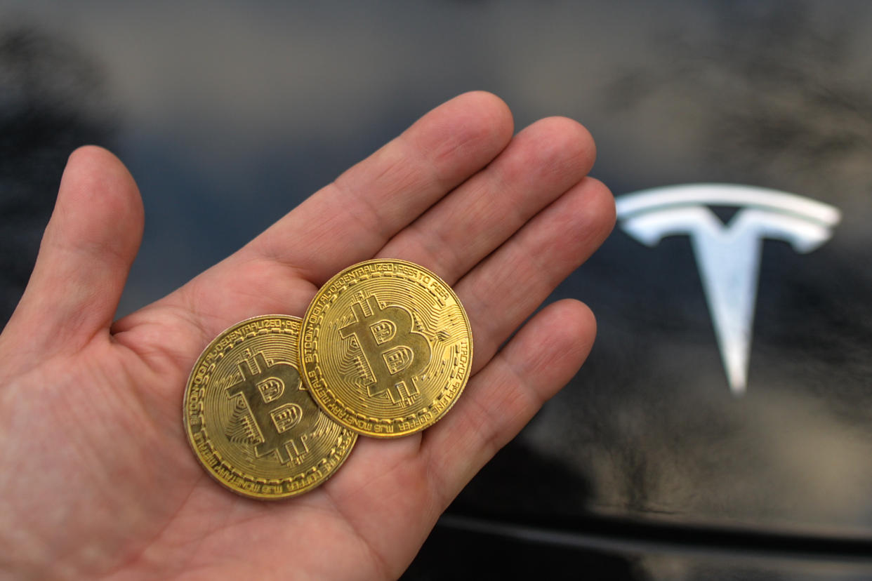 Illustrative image of two commemorative bitcoins seen in front of the Tesla car logo.
On Saturday, February 27, 2021, in Dublin, Ireland. (Photo by Artur Widak/NurPhoto via Getty Images)