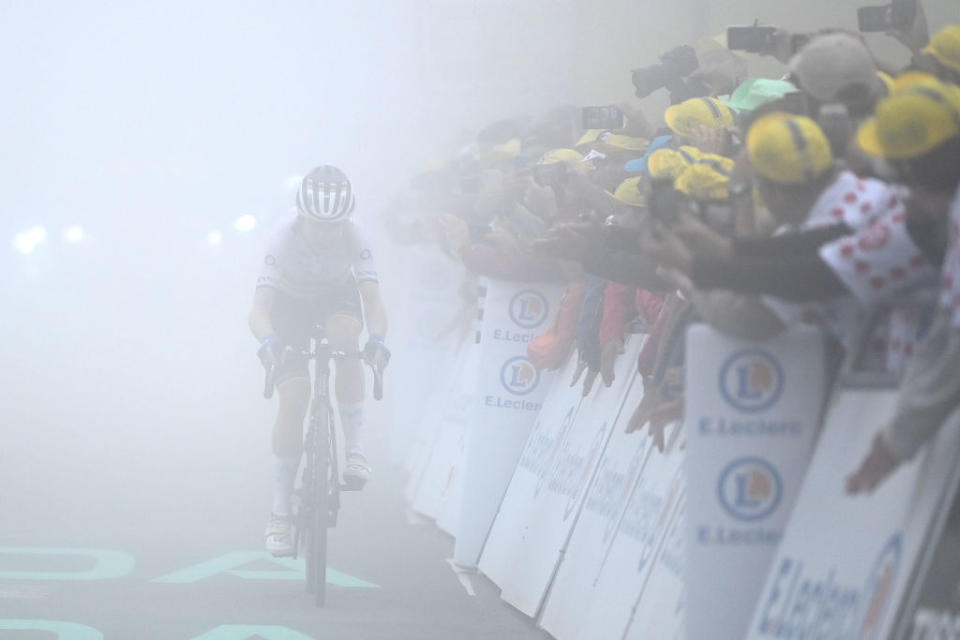 Annemiek Van Vleuten (Movistar) crosses the finish line under very misty conditions