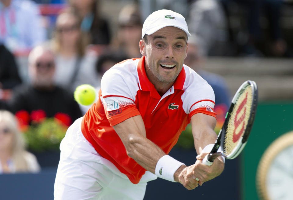 Roberto Bautista Agut, of Spain, returns to Gael Monfils, of France, during the Rogers Cup men’s tennis tournament Saturday Aug. 10, 2019, in Montreal.(Paul Chiasson/The Canadian Press via AP)