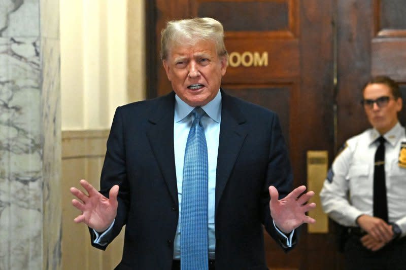 Former President Donald Trump speaks to the press after exiting the courtroom for a break in the third week of his civil fraud trial at State Supreme Court on Wednesday in New York City. Photo by Louis Lanzano/UPI