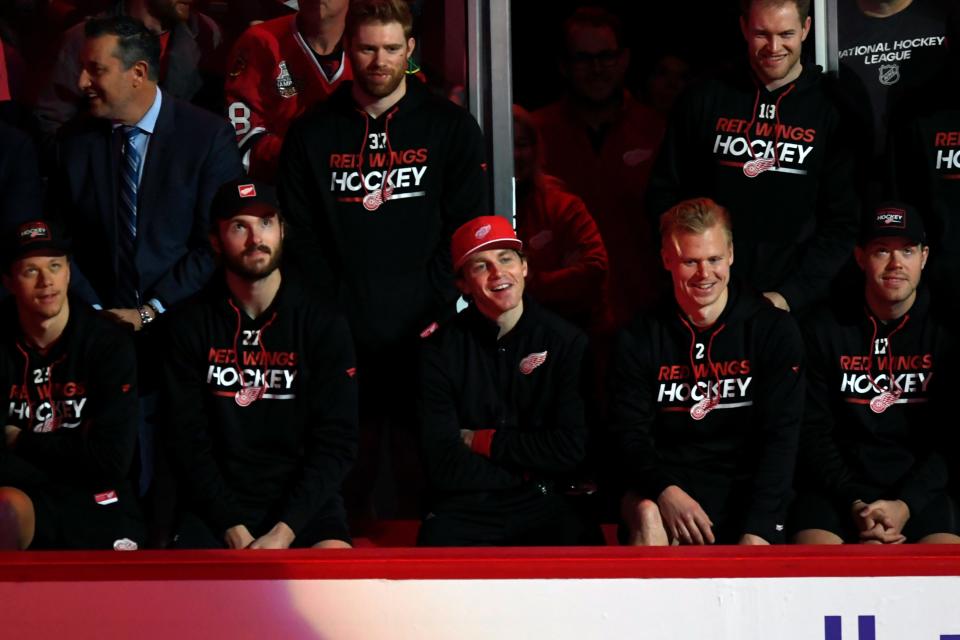 Former Chicago Blackhawks player and current Detroit Red Wings player Patrick Kane center, looks on during former Chicago Blackhawks great Chris Chelios' ceremony to retire his jersey before a game between the Chicago Blackhawks and Detroit Red Wings at United Center on Sunday, Feb. 25, 2024.