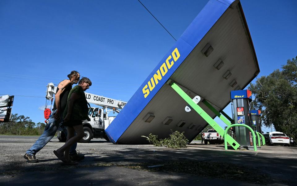 A toppled petrol station in Perry, Florida