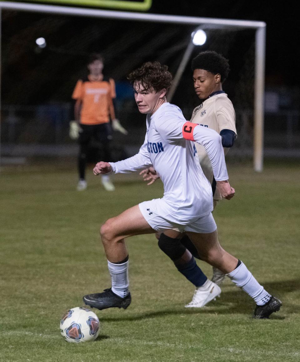 Anthony Lipnicky (11) controls the ball during the Booker T. Washington vs Gulf Breeze boys soccer game at Gulf Breeze High School on Thursday, Jan. 11, 2024.