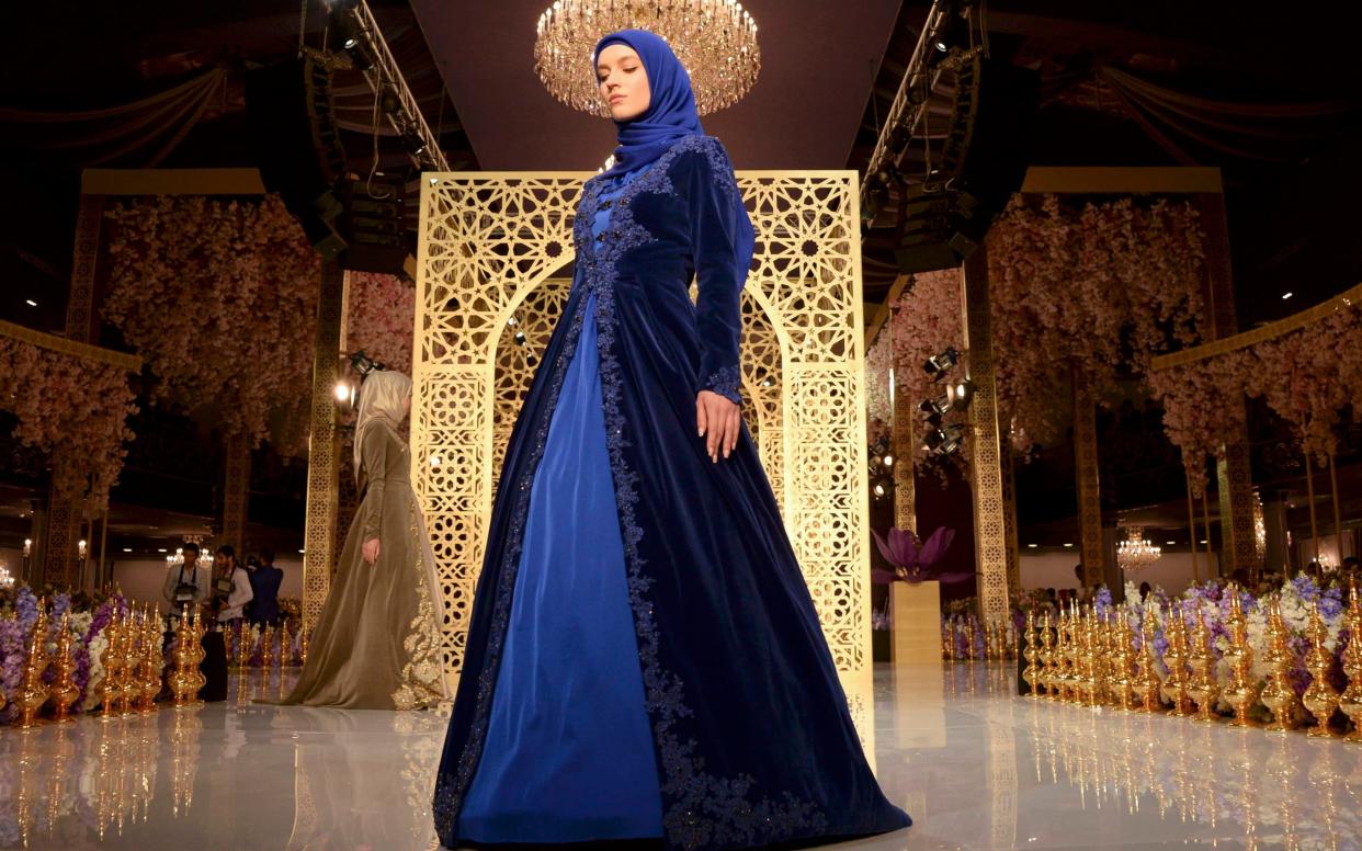 Models present creations by fashion designer Aishat Kadyrov, daughter of Chechen regional leader Ramzan Kadyrov - Reuters