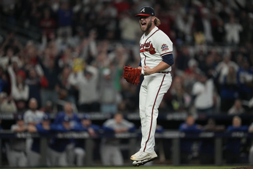 Atlanta Braves relief pitcher A.J. Minter celebrates after striking out Los Angeles Dodgers' Will Smith in the sixth inning in Game 6 of baseball's National League Championship Series Saturday, Oct. 23, 2021, in Atlanta. (AP Photo/Ashley Landis)