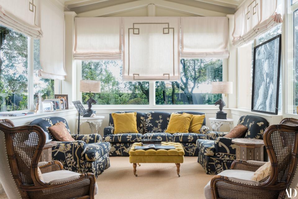 “This is one of my favorite places,” Bocelli says of this sun-filled room. “We have organized small press conferences and many interviews here. But sometimes we watch TV here as a family.” The navy couches are antique pieces from Montecarlo.