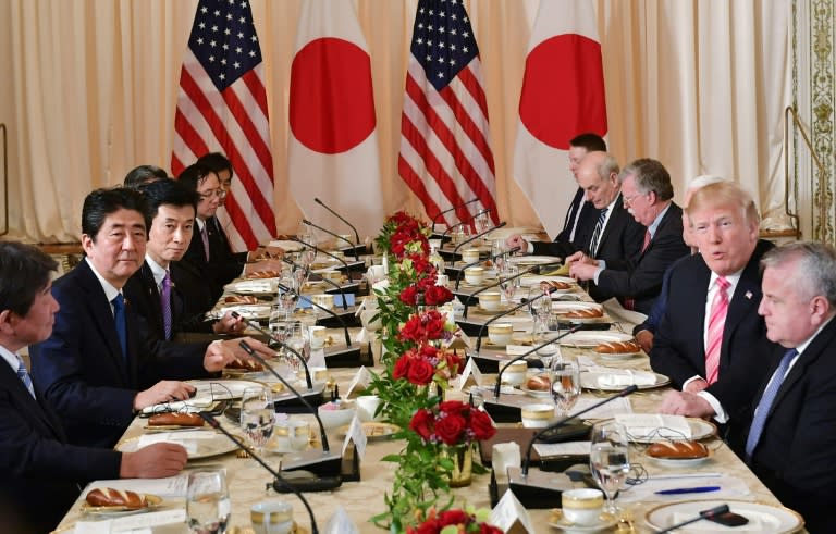 US President Donald Trump and Japan's Prime Minister Shinzo Abe take part in a working lunch at Trump's Mar-a-Lago estate in Palm Beach, Florida
