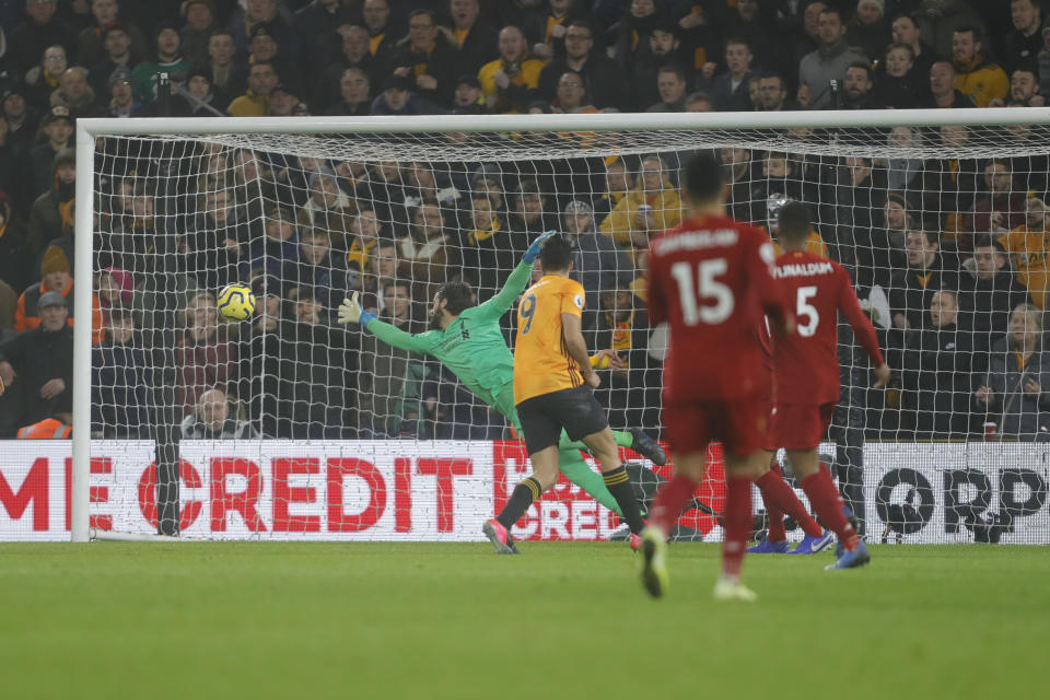 WOLVERHAMPTON, ENGLAND - JANUARY 23: Raul Jimenez of Wolverhampton Wanderers scores a goal to make it 1-1 during the Premier League match between Wolverhampton Wanderers and Liverpool FC at Molineux on January 23, 2020 in Wolverhampton, United Kingdom. (Photo by James Baylis - AMA/Getty Images)