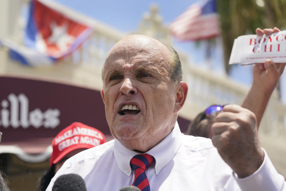 Former New York City Mayor, Rudy Giuliani gestures as he speaks at a news conference in support for the people of Cuba, Monday, July 26, 2021, at the Versailles Cuban restaurant in the Little Havana neighborhood of Miami. (AP Photo/Wilfredo Lee)