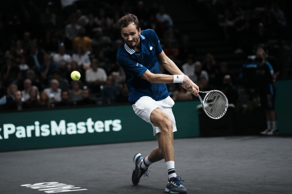 Russia's Daniil Medvedev returns the ball to Serbia's Novak Djokovic during the final match of the Paris Masters tennis tournament at the Accor Arena in Paris, Sunday, Nov.7, 2021. (AP Photo/Thibault Camus)