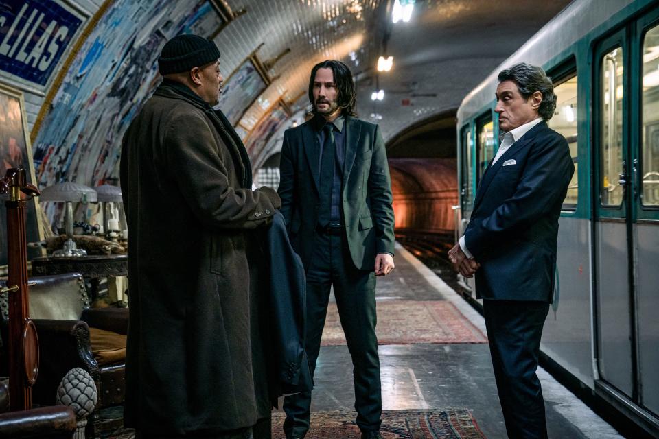John Wick (Keanu Reeves, center) prepares for a duel with associates Bowery King (Laurence Fishburne) and Winston (Ian McShane) in "John Wick: Chapter 4."