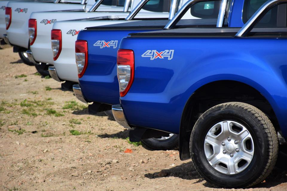 Pultusk, Poland - April, 25th, 2015: Ford Ranger vehicles stopped on the unmade road in a row. The newest generation of Ranger was debut in 2011 on the market. These vehicles are used to get in extremely hard areas and they have payloads from 1 to 1,3 tonnes.